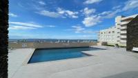 Bazén v ubytování Apartamento frente al mar con piscina nebo v jeho okolí