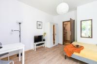 Posteľ alebo postele v izbe v ubytovaní SuperApart Kierbedzia