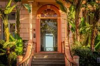 a front door of a building with stairs and plants at Best Western Premier Hotel Prince de Galles in Menton