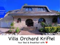 a brick house with the words villa orland kittitt on it at VILLA ORCHARD Frankfurt in Zeilsheim