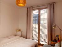 Posteľ alebo postele v izbe v ubytovaní Appartement T3 Confluence