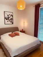 Posteľ alebo postele v izbe v ubytovaní Appartement T3 Confluence