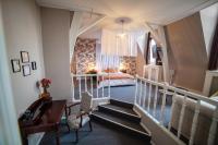 a room with a staircase leading to a bedroom at MAISON RENARD in Béthune