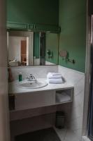 a bathroom with a sink and a mirror at MAISON RENARD in Béthune