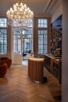 a large room with a chandelier and a table at MAISON RENARD in Béthune