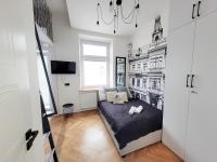 Televízia a/alebo spoločenská miestnosť v ubytovaní Grand Theater Apartments