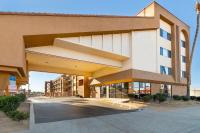 a large building with a parking lot in front of it at Days Inn by Wyndham Chula Vista-San Diego in Chula Vista