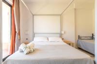 A bed or beds in a room at Villa Oidor - Cilento