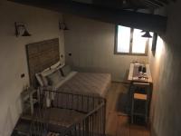 Łóżko lub łóżka w pokoju w obiekcie Corte degli Angeli Agriturismo