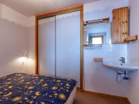 a bathroom with a bed and a sink at Appartement Méribel, 3 pièces, 6 personnes - FR-1-355-48 in Méribel