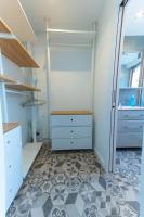 a room with a closet with white cabinets and a floor at Best place à 15 min de Paris in Saint-Maur-des-Fossés