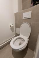 a bathroom with a toilet with a roll of toilet paper at Best place à 15 min de Paris in Saint-Maur-des-Fossés