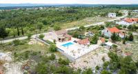 an aerial view of a house with a swimming pool at Villa Lucia in Skradin