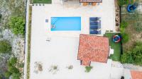an overhead view of a swimming pool with a roof at Villa Lucia in Skradin