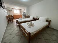 Posteľ alebo postele v izbe v ubytovaní Athina Rooms