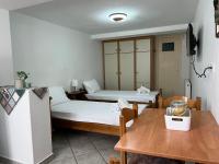 Posteľ alebo postele v izbe v ubytovaní Athina Rooms