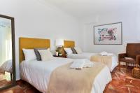 A bed or beds in a room at Genteel Home Ático Gran Capitán