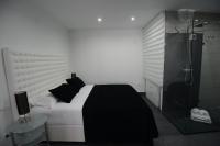 A bed or beds in a room at Apartamentos Torrecilla
