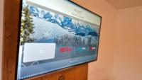 Televízia a/alebo spoločenská miestnosť v ubytovaní Das Alpin - Hotel Garni Guesthouse