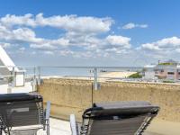 a balcony with chairs and a view of the beach at Apartment Claire-4 by Interhome in Arcachon