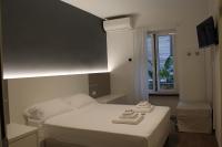 Albergo Augusta B&Bにあるベッド
