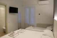 Albergo Augusta B&Bにあるベッド