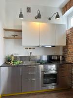 Kuchyňa alebo kuchynka v ubytovaní Lofts Cracow Apartments - City Center