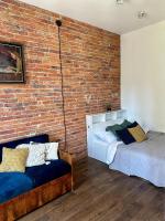 Posteľ alebo postele v izbe v ubytovaní Lofts Cracow Apartments - City Center