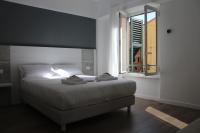 Albergo Augusta B&Bにあるベッド