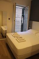 Albergo Augusta B&Bにあるベッド
