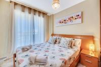 Łóżko lub łóżka w pokoju w obiekcie VB Marysol - 2BR apartment close to the beach