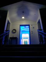 a stairway with a blue door in a room at Alisaxni Studios in Argassi