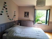 Łóżko lub łóżka w pokoju w obiekcie Maison cosy à Saint-Méloir-des-Ondes avec jardin privé