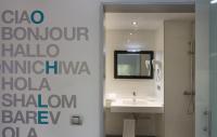 a bathroom with a sink and a mirror at Salamanca Suite Studios in Salamanca