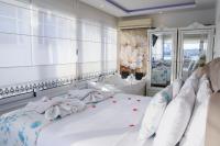 Postel nebo postele na pokoji v ubytování Dantela Butik Hotel