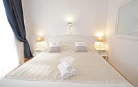Posteľ alebo postele v izbe v ubytovaní Tinel Rooms Old City Center