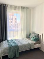 Una cama o camas en una habitaci&oacute;n de Chambre dans logement neuf, Paris, Disney, Centrex