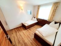 A bed or beds in a room at Haus Leitner