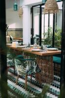 a dining room with a table with a zebra chair at Dar El Gaied in Nabeul