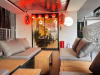 a restaurant with two couches and a table and chairs at Ano Hotel Asakusa in Tokyo
