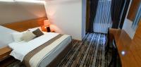Postel nebo postele na pokoji v ubytování Bulvar Hotel