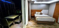 Postel nebo postele na pokoji v ubytování Bulvar Hotel