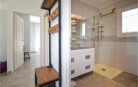a bathroom with a sink and a glass shower at 2 Bedroom Amazing Home In Saint-ambroix in Saint-Ambroix