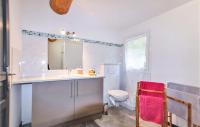 a bathroom with a sink and a toilet at Cozy Home In Merindol With Outdoor Swimming Pool in Mérindol
