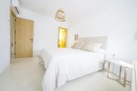 Posteľ alebo postele v izbe v ubytovaní Moott Homes Suites Villa Costacabana