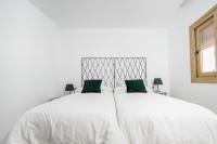 Posteľ alebo postele v izbe v ubytovaní Moott Homes Suites Villa Costacabana