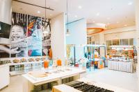 a store with a large display case in a room at HARRIS Hotel Batam Center in Batam Center