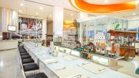 a store with a long counter in a store at HARRIS Hotel Batam Center in Batam Center