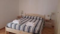Łóżko lub łóżka w pokoju w obiekcie La casa di Alessia