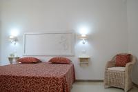 A bed or beds in a room at Arbor Exclusive B&B